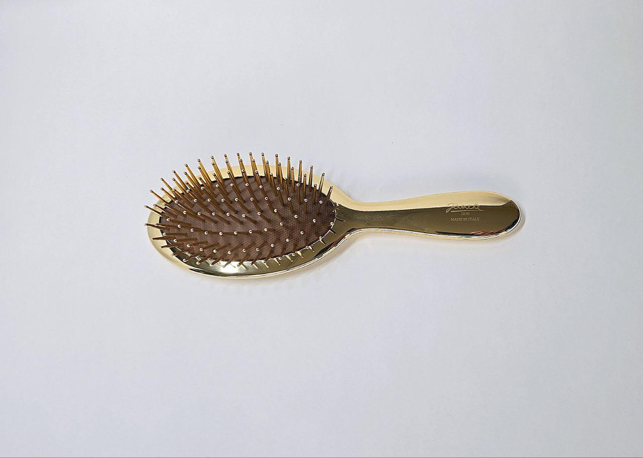 Golden air-cushioned brush with gold pins